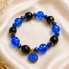 Elegant Guru Ji bracelet for women with blue and black pearl beads and spiritual Guru Ji blessings charm